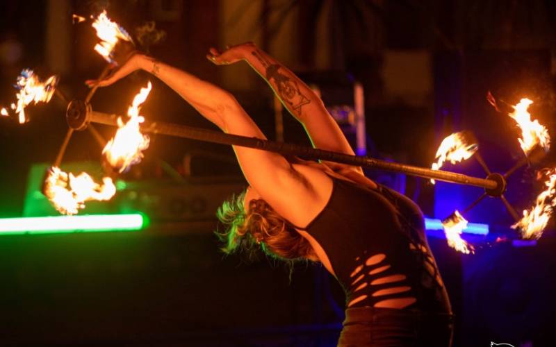 Woman doing fire display show.