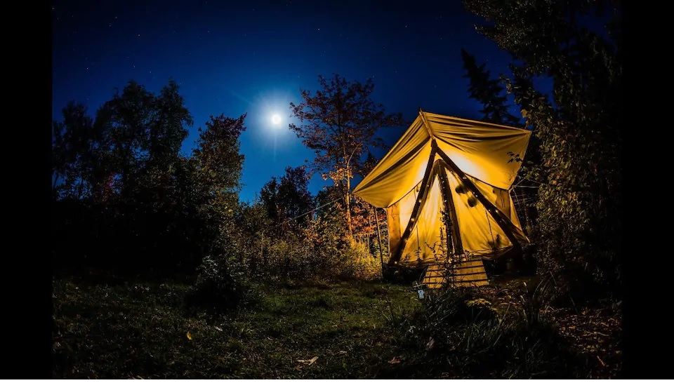 Glamping Tent at night under moon