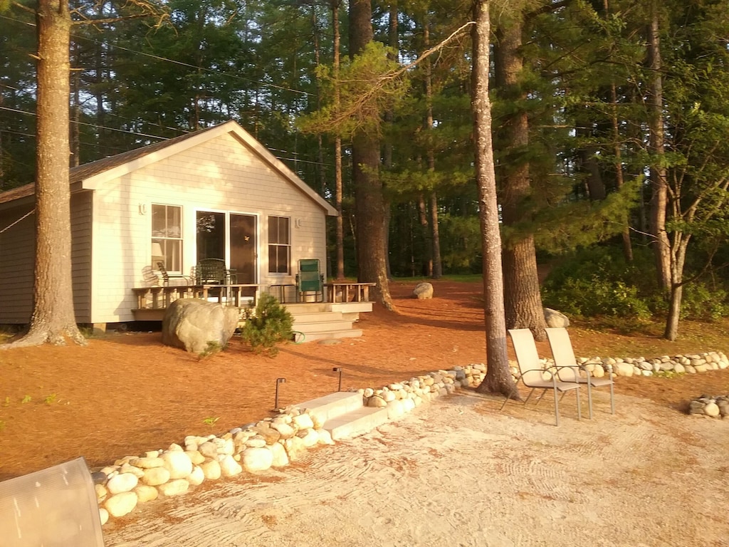 charming lakefront cottage with sandy beach on a large private wooded lot
