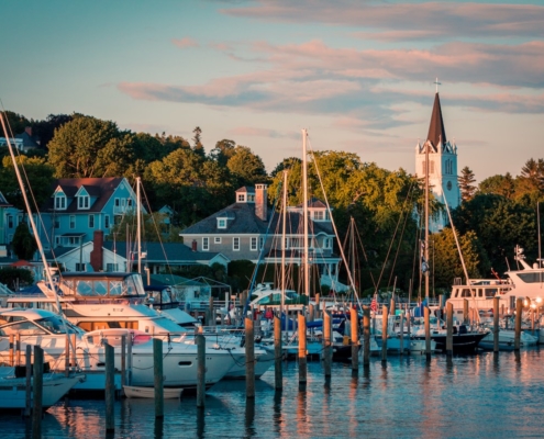 The Marina at Mackinac Island with Saint Anne's church and the historic Victorian houses a sunset shot from Lake Michigan