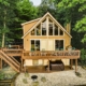 Luxury Cabins in Poconos lakefront with hot tub kayak fire pit and pool