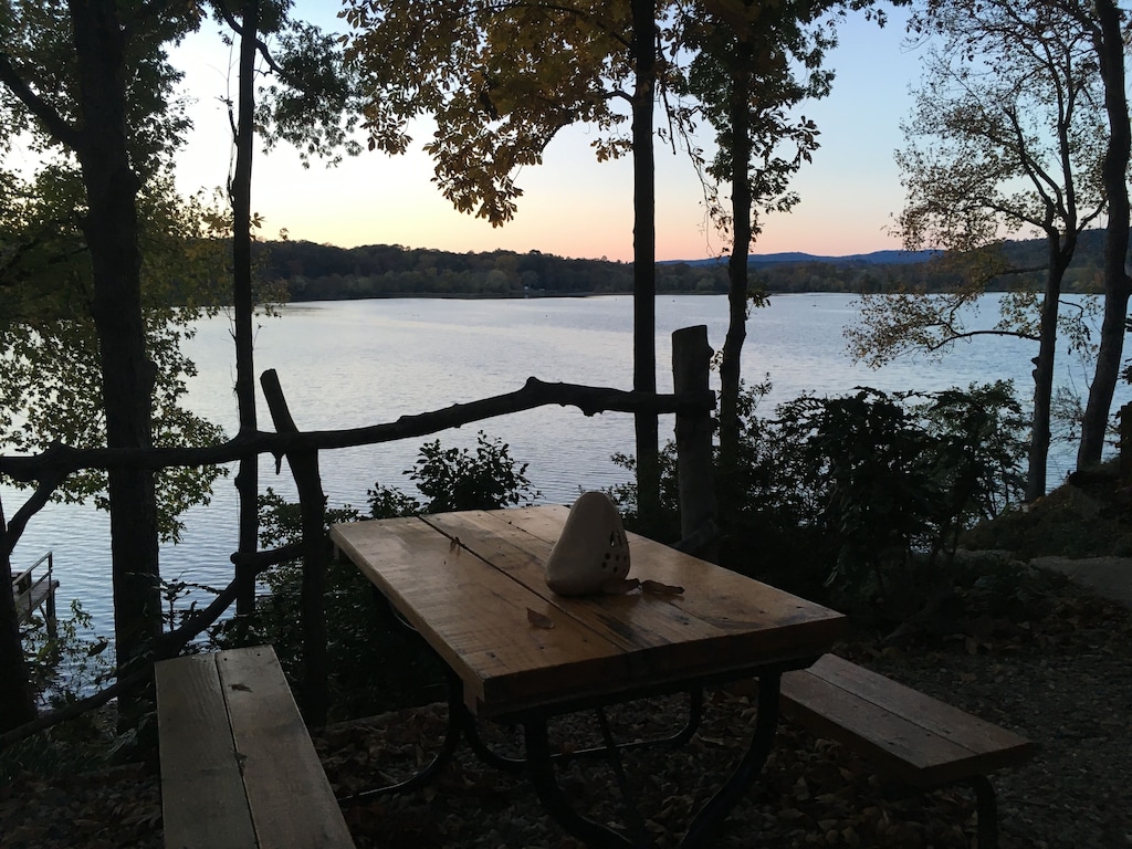 Secluded Cabins in Arkansas with paddle boat and fire pit