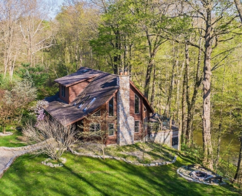 Secluded Cabins in Michigan riverfront close to town with hot tub and fire pit