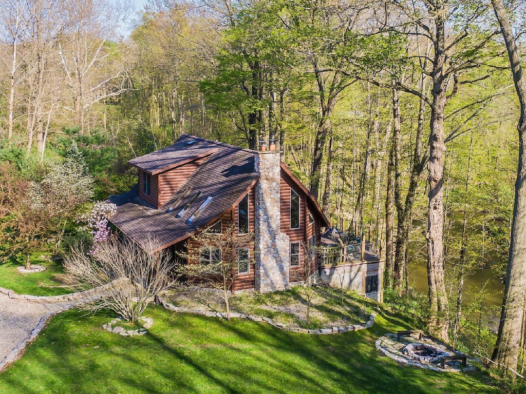Secluded Cabins in Michigan riverfront close to town with hot tub and fire pit