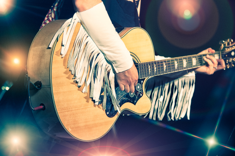 Woman guitarist in the country band