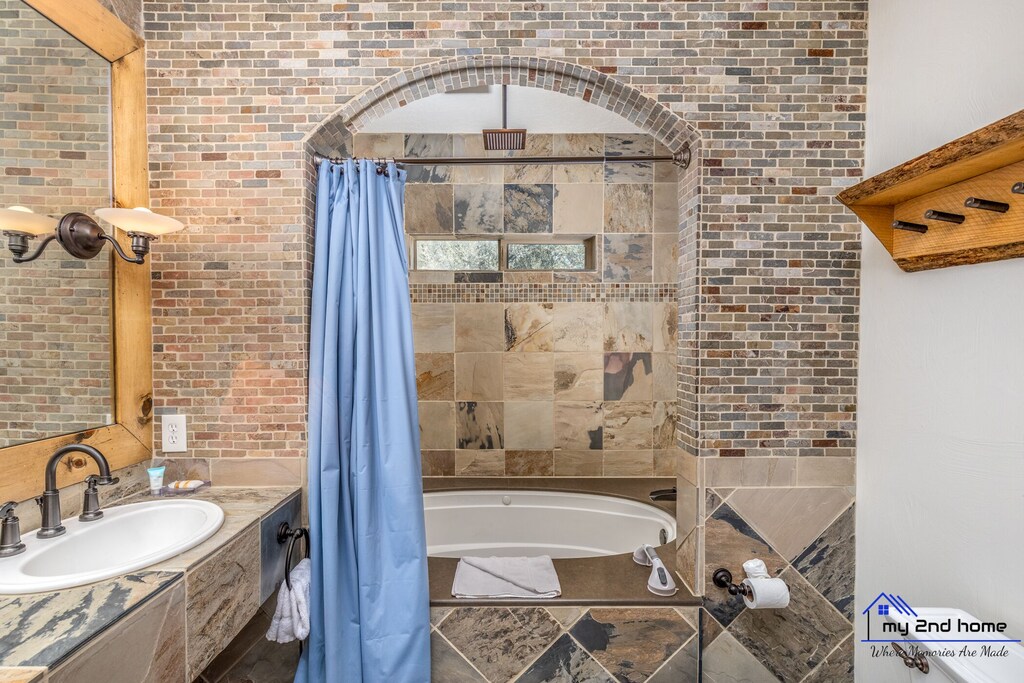 Inside a bathroom with round bath tub