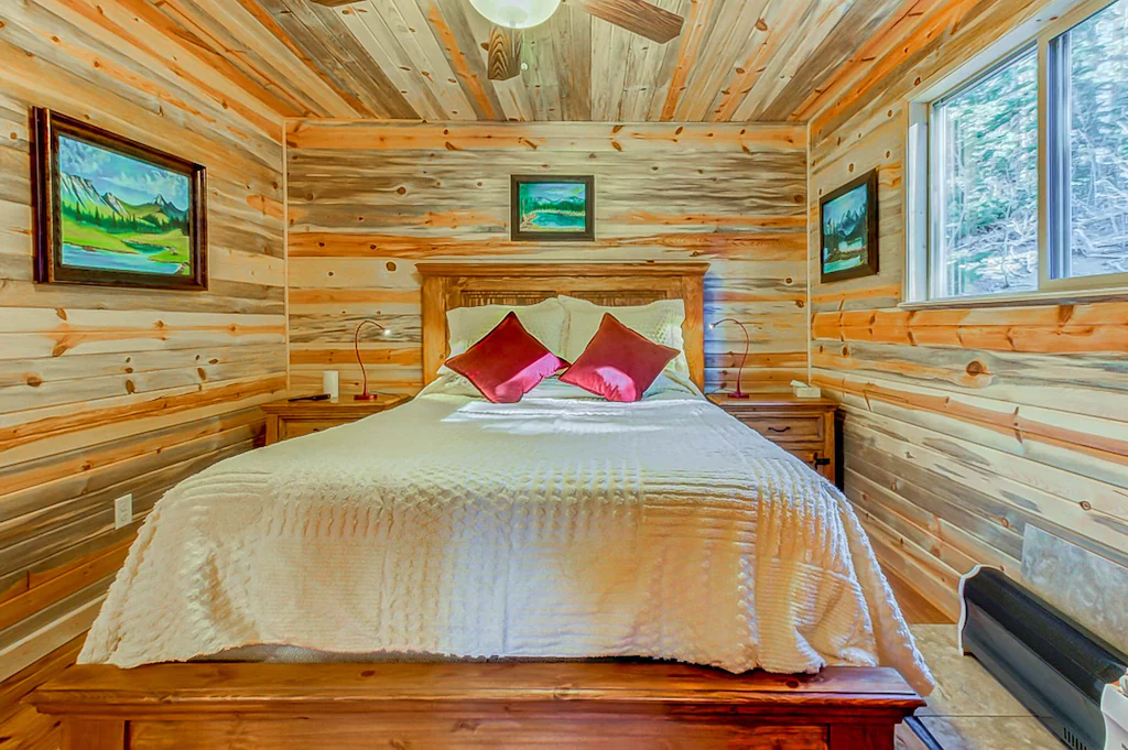 Master bedroom inside a wooden cabin