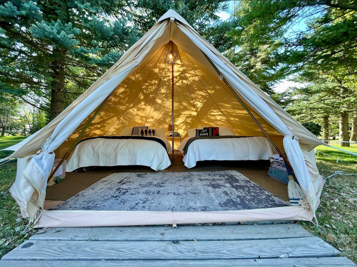 Two beds inside a tent