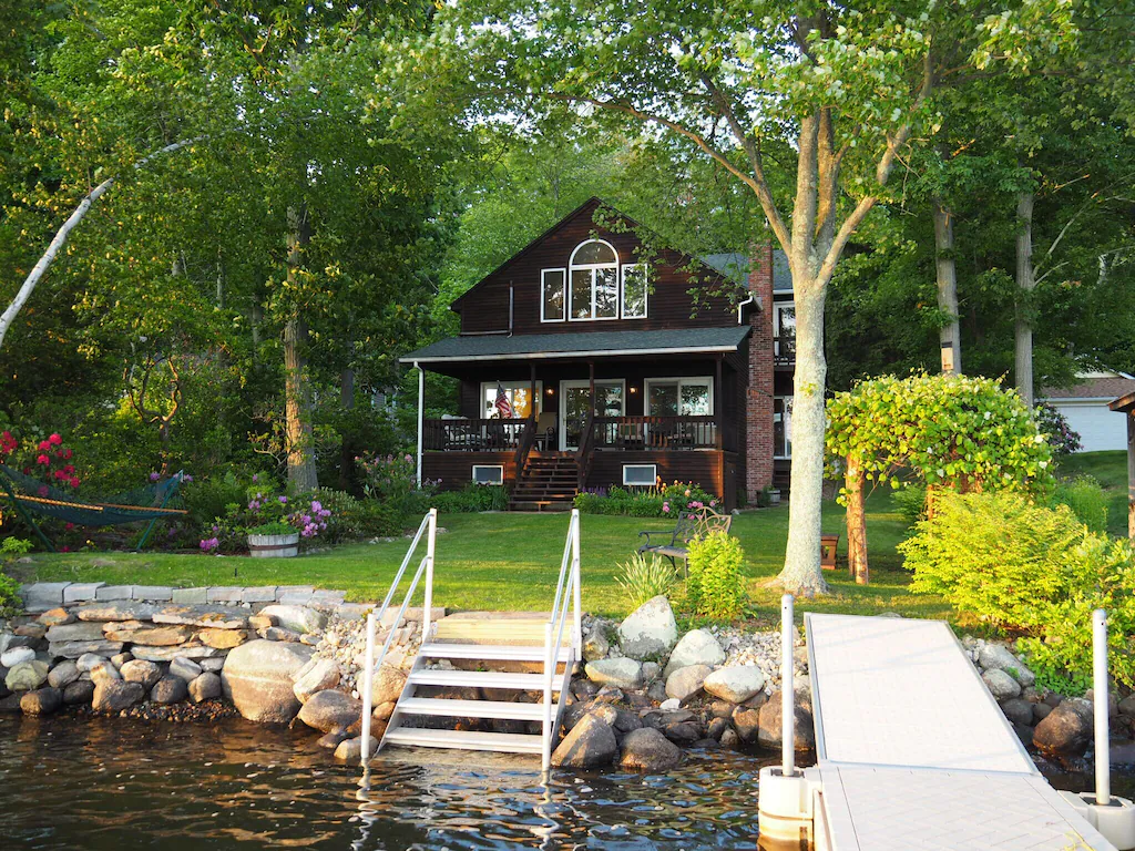 A home sits on a grassy lawn 