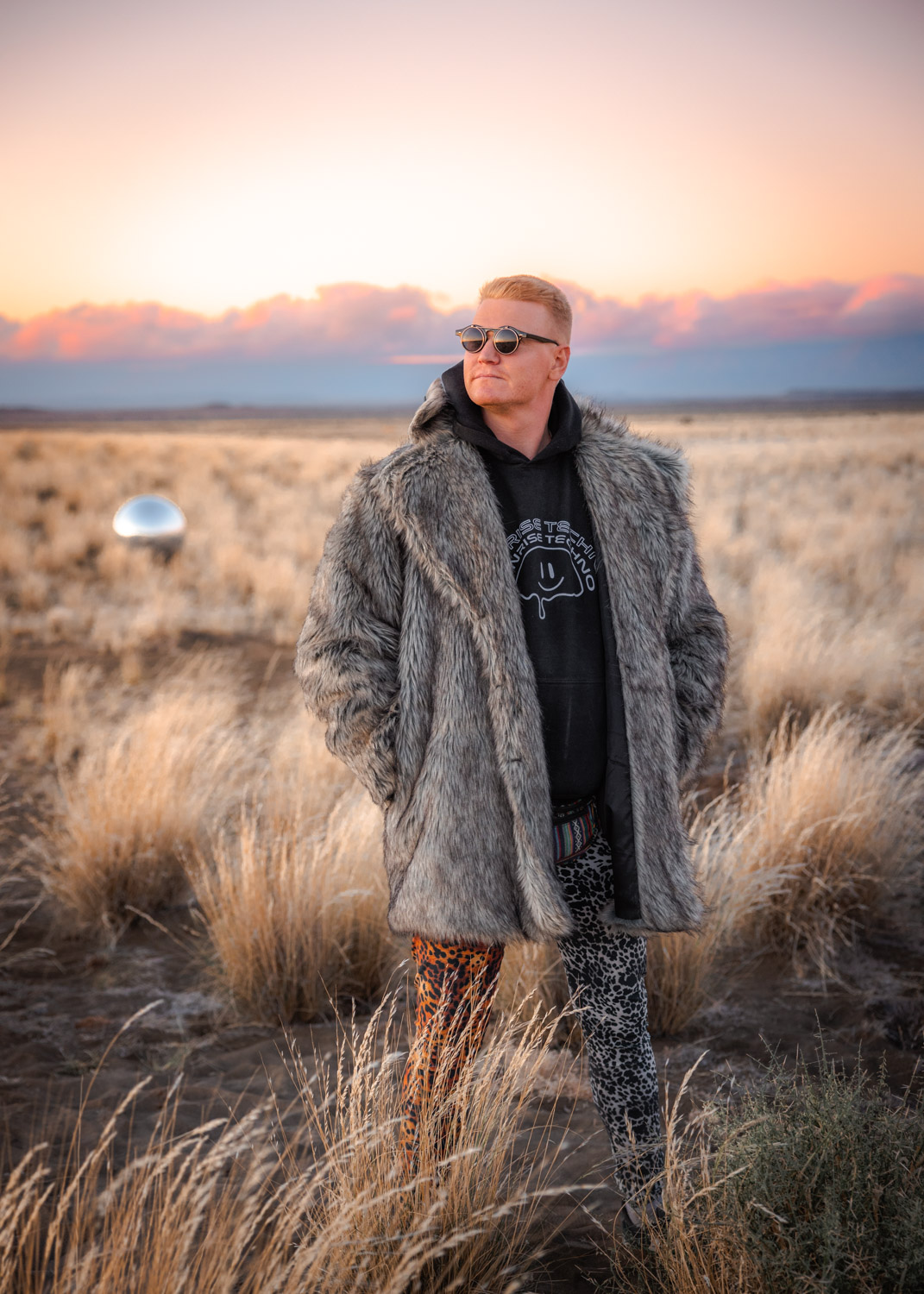 30 Burning Man Accessories, Clothing, Costumes & Outfits Man wearing fur coat at Burning Man